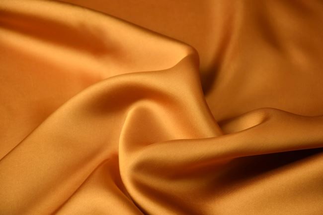 Tkanina bluzkowa/sukienkowa w kolorze musztardowym z połyskiem Q1015