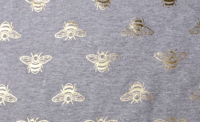 Dzianina bawełniana jasnoszara z nadrukiem foliowych pszczół 11652/063